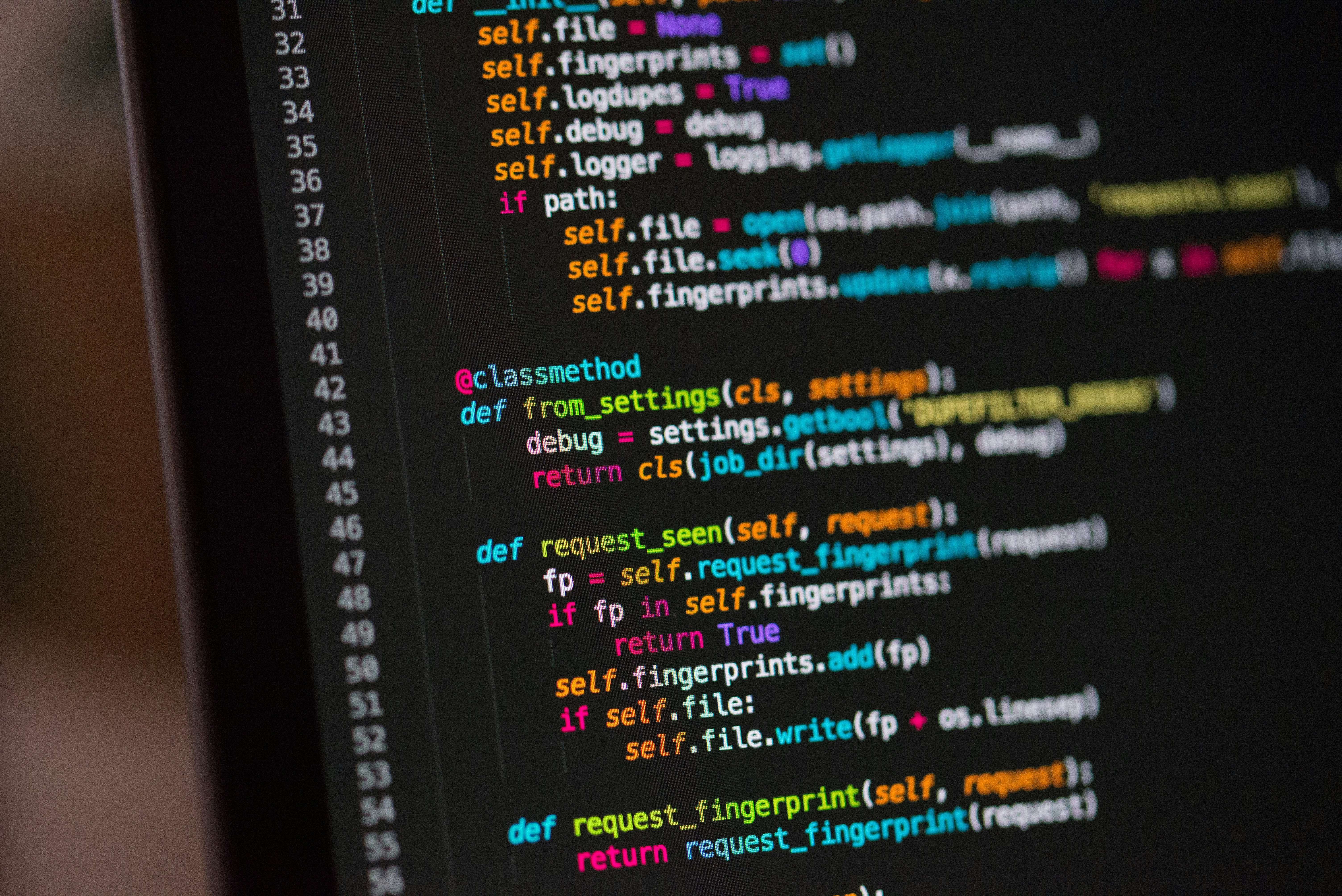Close-up of colorful code on a screen. The code is written in Python.