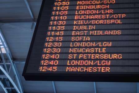Schedule and manage background jobs in Python with FastAPI, illustrated by an airport departure board